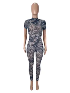 Detailed full-length view of sheer mesh jumpsuit featuring ornate oriental dragon print patterns