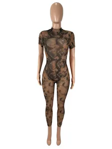Detailed view of the exotic snakeskin pattern on a sexy sheer mesh bodysuit jumpsuit