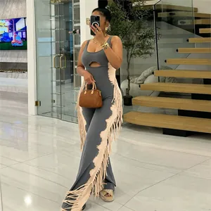 Trendy color block fringe jumpsuit with cut-out detail in a modern mirror selfie.