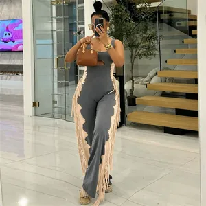 Elegant women's two-tone sleeveless jumpsuit with side fringe detailing and front cutout.