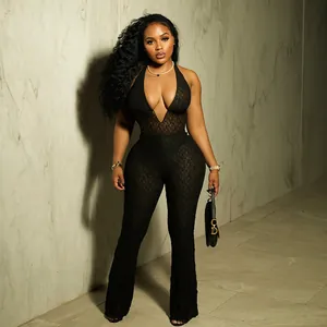 Professional studio shot of a sexy black lace halter jumpsuit featuring a deep V-neck line