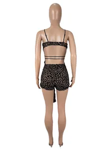 Back view of sexy leopard print mesh bodysuit with cutout lace-up detail on mannequin