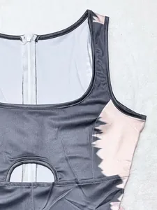 Detail shot of women's jumpsuit featuring square neckline and waist cutout with tie-dye pattern