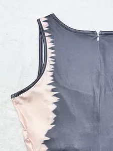 Close-up detail of women's jumpsuit with contrast zigzag pattern and back zipper