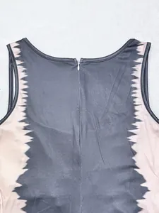 Close-up detail of the back invisible zipper on a stylish colorblock sleeveless jumpsuit