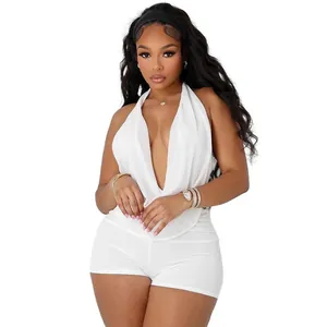 Detail view of sexy white mesh halter top and shorts two-piece set on a model