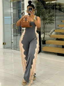 Stylish contrast color sleeveless jumpsuit featuring cutout waist and long fringe detail