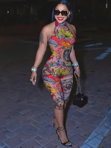 Sexy floral print mesh bodycon jumpsuit featuring halter neck and backless design