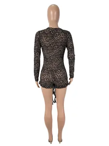 Back view of sexy leopard print mesh bodysuit with long sleeves and tie detail.