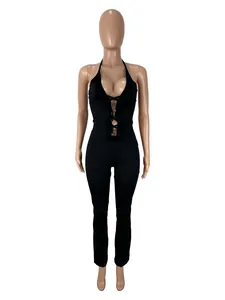 Front view detail of a sexy black halter jumpsuit with lace patchwork on a mannequin