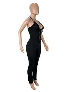 Side profile view of a sexy black halter jumpsuit featuring delicate lace patchwork