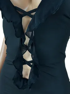 Detailed macro view of black sexy jumpsuit featuring mesh ruffles and lattice strap chest design