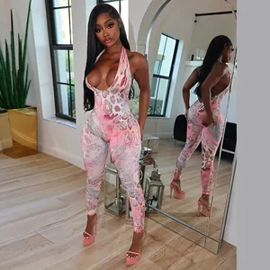 Detail view showing the sexy halter neckline and backless design of a pink jumpsuit