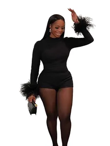 Sexy black bodycon romper featuring dramatic faux feather cuffs and a sleek round neck