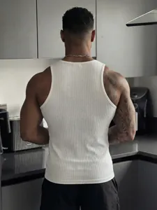Men's white ribbed fitness tank top, back view detail in a modern kitchen setting