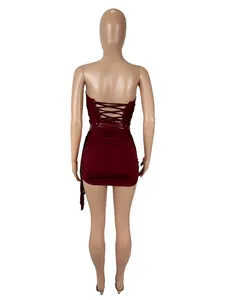 Back view of sexy burgundy strapless lace-up top and bodycon skirt set on mannequin