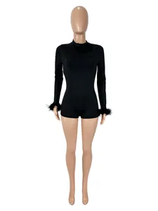 Chic black long-sleeve bodysuit featuring stylish faux fur cuffs and a tight silhouette