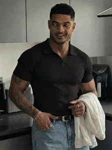 Close-up of men's slim fit black ribbed Polo shirt with V-neck design