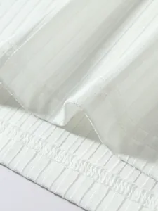 Close-up of white ribbed fabric texture and hem stitching on men's fitness tank top