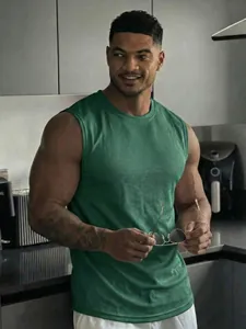 Detail of a men's green mesh athletic tank top showing breathable fabric and wide shoulders.