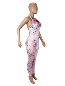 Side view of a sexy pink marble print halter neck backless bodycon jumpsuit