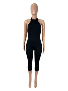 Detailed view of women's black ribbed halter neck bodysuit with high waist slim fit design