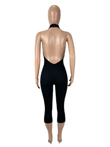 Detailed back view of a sexy black backless ribbed bodycon halter neck jumpsuit