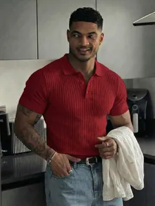 Close-up of men's red ribbed short sleeve polo shirt with stretch slim fit design