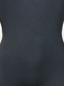 Macro close-up detail of black ribbed stretch fabric texture for women's jumpsuit