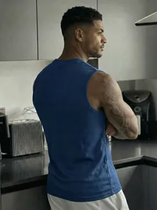 Close-up of a blue mesh sleeveless tank top for men showing the breathable fabric texture