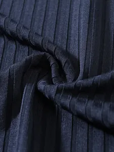 Macro detail shot showing the textured ribbed knit fabric of a navy blue men's sports vest