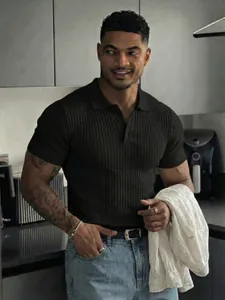 Close-up view of a men's slim fit ribbed short sleeve polo shirt with buttons