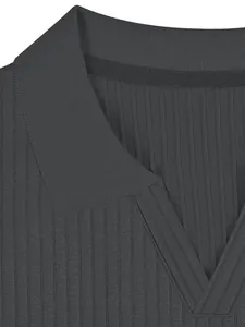 Close-up detail of the V-neckline and dark gray ribbed fabric on a men's casual polo shirt