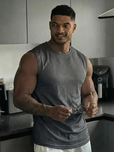 Detailed view of grey mesh breathable sports tank top for men's fitness training.