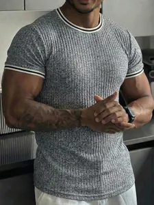 Close-up of men's gray ribbed athletic T-shirt with striped collar and cuffs