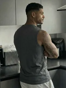 Back view of men's charcoal grey mesh sports tank top showing breathable fabric texture