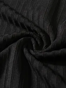 Close-up macro view of black ribbed elastic fabric showing high-quality texture and details