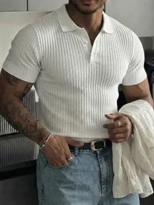 Detail view of a men's white ribbed slim fit polo shirt with buttons on a model.