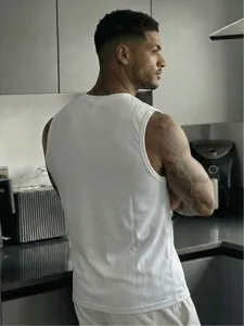 Rear view of men's white mesh fitness tank top showing breathable fabric texture