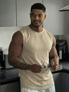 Professional detail shot of a beige mesh sleeveless tank top for men in a modern lifestyle setting