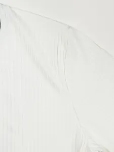 Close-up detail of white ribbed texture and shoulder seam on quick-dry sport t-shirt