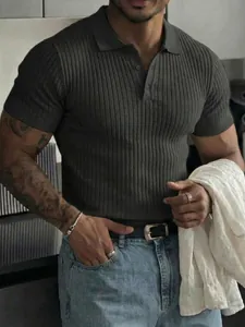 Detailed close-up of a men's dark grey ribbed short-sleeve polo shirt with buttons.