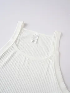 Close-up of white ribbed men's tank top showing square neck and care label detail.