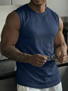 Close-up of navy blue mesh workout tank top showing breathable fabric on muscular model
