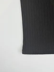 Detailed view of the black ribbed quick-dry fabric on this men's athletic t-shirt
