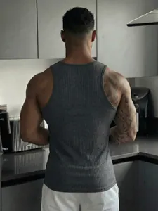 Professional back view of a muscular man wearing a grey ribbed sports fitness tank top