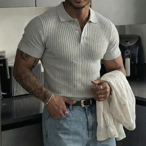 Close-up view of a men's grey ribbed short-sleeve polo shirt with buttoned collar.