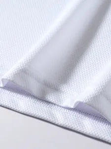 Close-up of breathable white mesh fabric with high-quality hem stitching detail