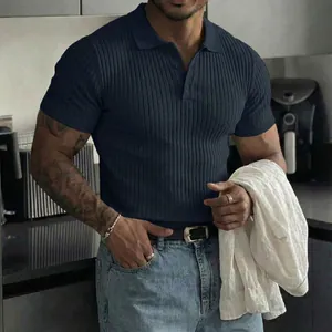 Detail view of a men's navy blue ribbed knit polo shirt featuring a button placket