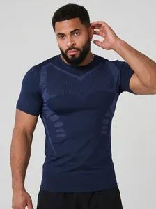 Close-up of navy blue mens sports compression T-shirt showing breathable dot patterns